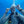 Person scuba diving underwater with bubbles and equipment.