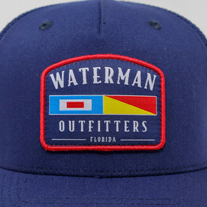 Blue cap with 'Waterman Outfitters' logo on a white background