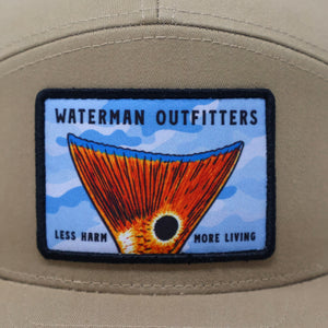 Beige cap with a colorful patch featuring 'Waterman Outfitters' on a white background