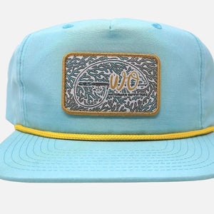 Light blue cap with a decorative patch on a white background