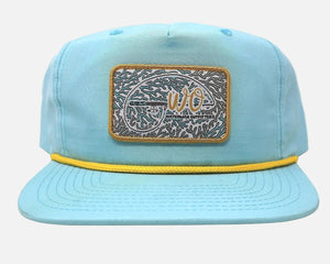 Light blue cap with a decorative patch on a white background
