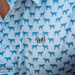Close-up of a shirt with blue dog pattern and logo on a white background