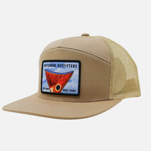 Beige trucker hat with a patch on a white background